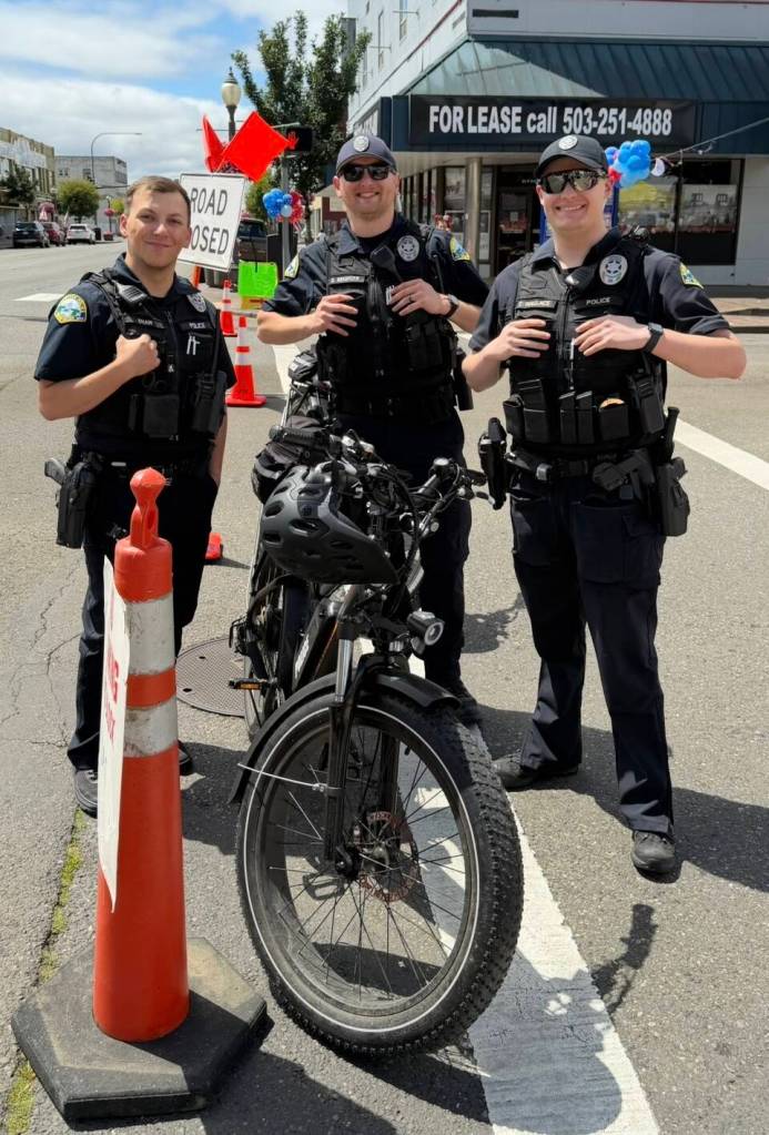 Aberdeen officers Jacob Shaw (from left), Dakota Reninger,and Tommy Wallace watch the corner of Wishkah and Broadway during Aberdeens festival Saturday.