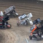 Sprint Cars fly into the first turn of their final Friday at Grays Harbor Raceway.