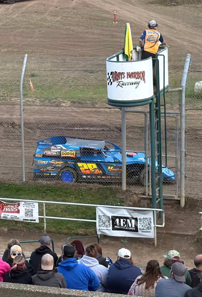 T. Michaels photos / The Daily World
Oakvilles Brian Harding takes the checkered flag finishing first in his Heat Race Friday at Grays Harbor Raceway.