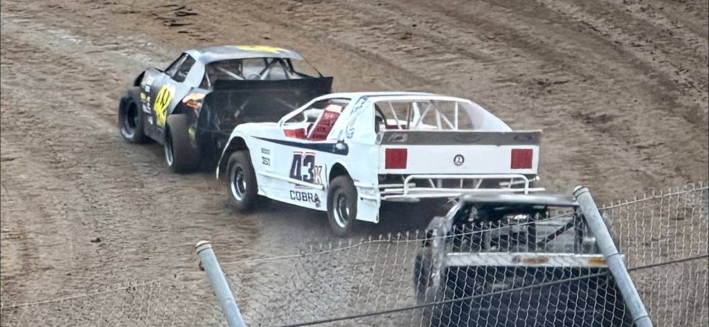Close quarters: Shane Kerrigan (#43) works for position behind Scott Fritz during the Super Stock final at the raceway.