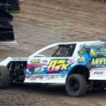 Last Friday nights Modifieds final winner Brenton Schnitzer (#87) slides through turn one at the raceway during an earlier Heat Race.