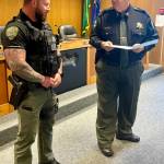 Jerry Knaak / The Daily World
Grays Harbor County Sheriff Darrin Wallace presents a lifesaving award to Deputy Benjamin Eaton.