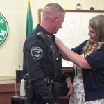 City of Hoquiam
Hoquiam Chief of Police Jeff Salstrom has his badge pinned on by his wife Jessica.