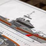 Petty Officer 2nd Class Briana Carter
A preliminary blueprint of the second-generation special-purpose craft  heavy weather (SPC-HWX II) boat sits on display during a keel laying authentication, July 8, in Mount Vernon.