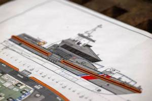 Petty Officer 2nd Class Briana Carter
A preliminary blueprint of the second-generation special-purpose craft  heavy weather (SPC-HWX II) boat sits on display during a keel laying authentication, July 8, in Mount Vernon.