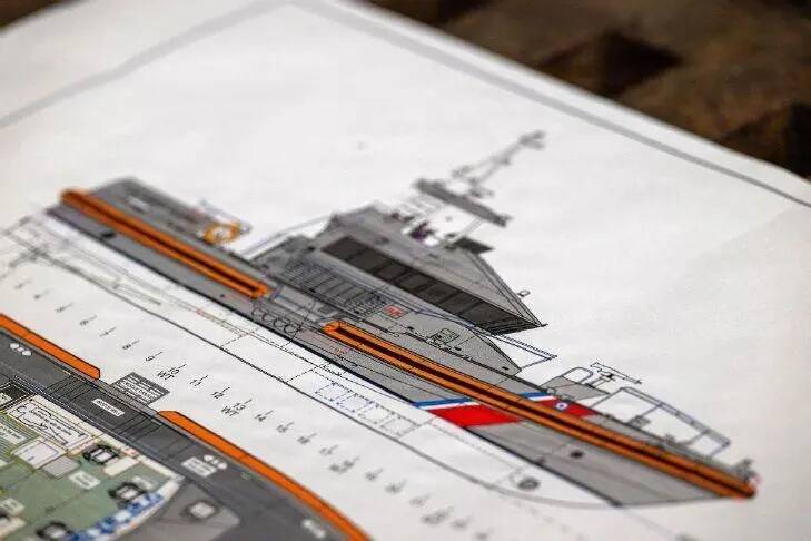 Petty Officer 2nd Class Briana Carter
A preliminary blueprint of the second-generation special-purpose craft  heavy weather (SPC-HWX II) boat sits on display during a keel laying authentication, July 8, in Mount Vernon.