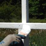 Andrea Watts / The Daily World
A coat of paint touches up the cross after its erected.