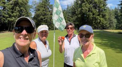 SUBMITTED PHOTOS Tammy wade (second from right) recorded her first ace on Tuesday at Highlands Golf Course in Cosmopolis. Wade used a 7-iron to sink a hole-in-one on the par-3 No. 12 hole. Her shot was witnessed by (from left) Mel Bickar, Cherry Scure and Bonnie Sell.