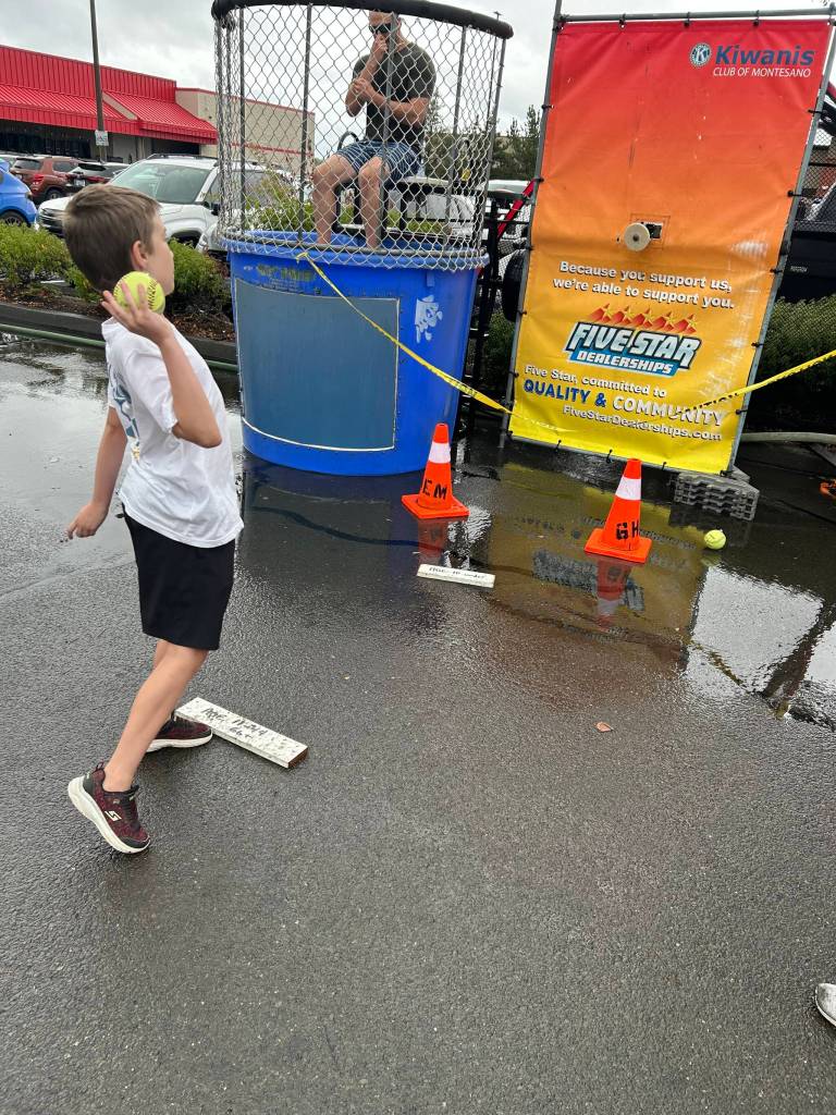 A young one took his chances at the Kiwanis Club dunk tank manned by police and fire officers.