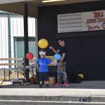 Alex Zerbe teams up with a volunteer during his Zaniac comedy show at the Grays Harbor County Fair. (Jerry Knaak / The Daily World)