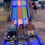 T. Michaels photos / For The Daily World
A mom and kids make it to the bottom of the Super Slide together at the Grays Harbor County Fair Saturday.