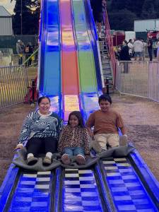 T. Michaels photos / For The Daily World
A mom and kids make it to the bottom of the Super Slide together at the Grays Harbor County Fair Saturday.