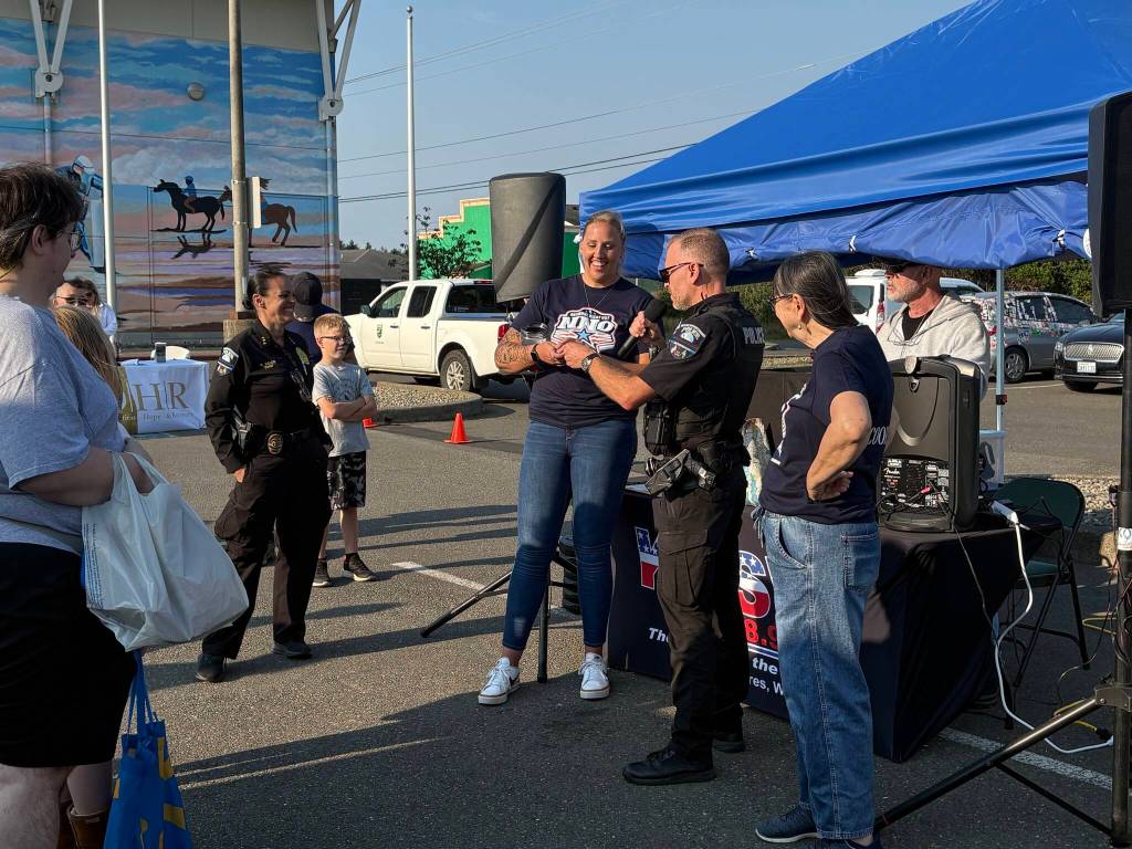The Ocean Shores Police Department and National Night Out coordinators conducted a raffle. (Jerry Knaak / The Daily World)