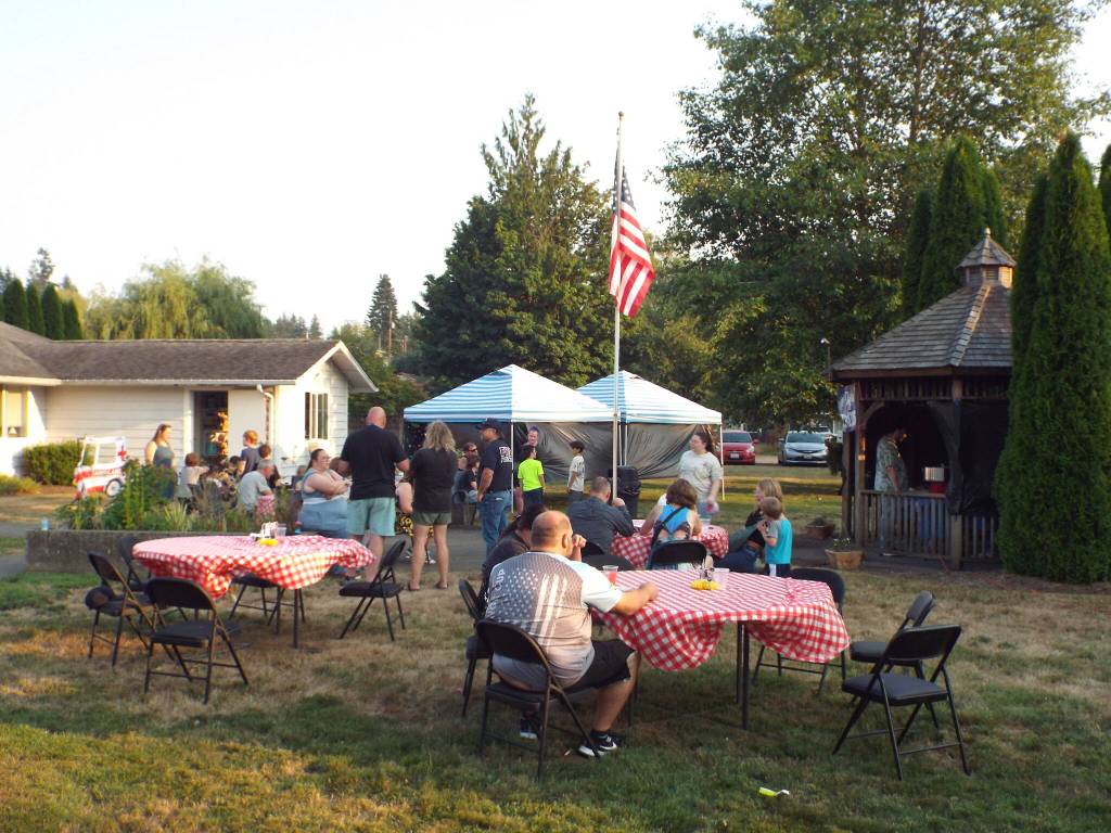 Andrea Watts / The Daily World
In McCleary, residents could partake in two National Night Out events. At the Beehive Retirement Community, Police Officer Adam Moutaftsis and Adam Collins, with East Grays Harbor Fire and Rescue, dropped by to visit with residents and families.