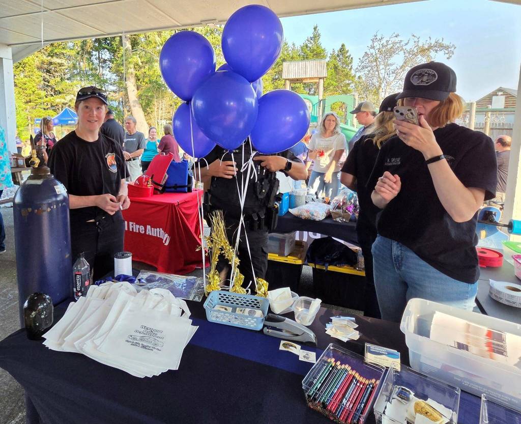 There were giveaways aplenty at the Westport National Night Out. (John Shaw / For The Daily World)