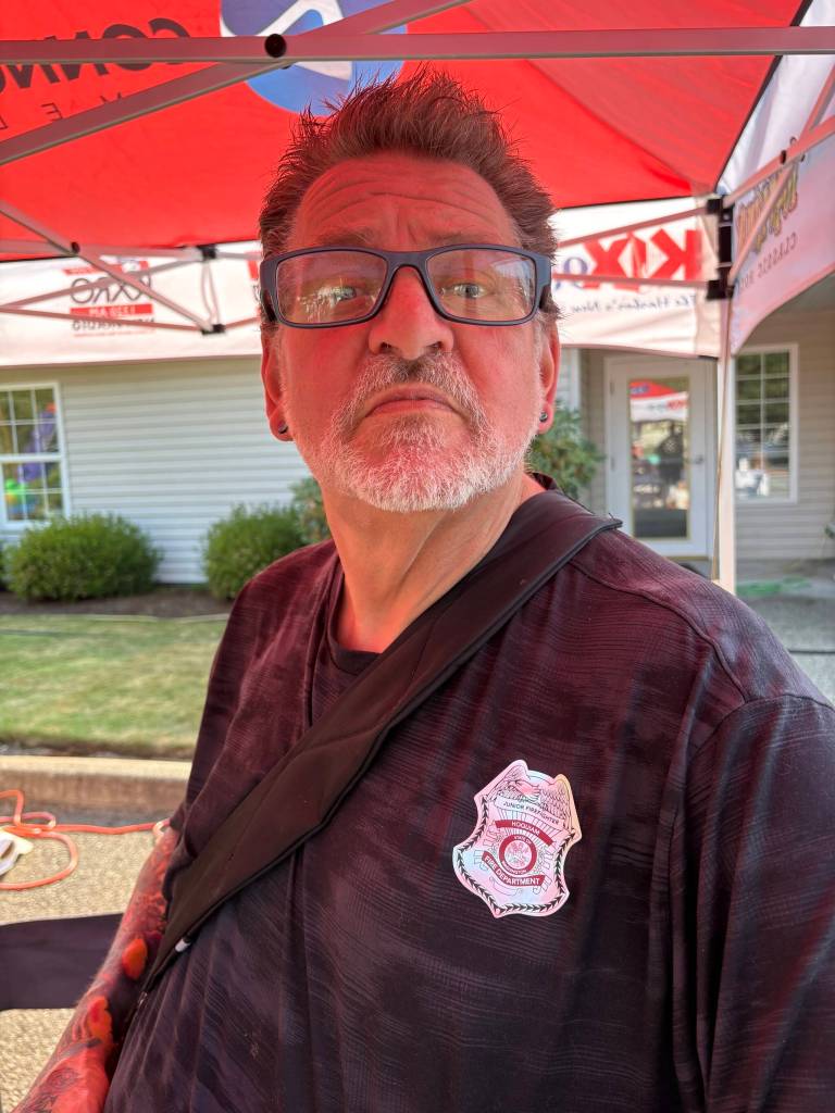 Radio personality Rick Moyer was appointed Hoquiam Junior Firefighter at the Riverside Place Memory Care National Night Out. (Jerry Knaak / The Daily World)