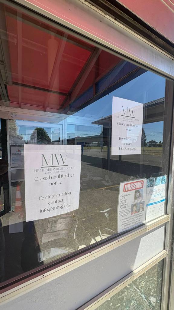 Jerry Knaak / The Daily World
Signs affixed to the Moore Wright Groups Aberdeen headquarters state, Closed Until Further Notice.