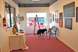 Patrick Webb photos / For the Observer
Nima, a black labrador-border collie mix, checks out a gallery at the Aberdeen Art Center filled with exhibits for the The Art of Resistance, a juried art show on display through September.